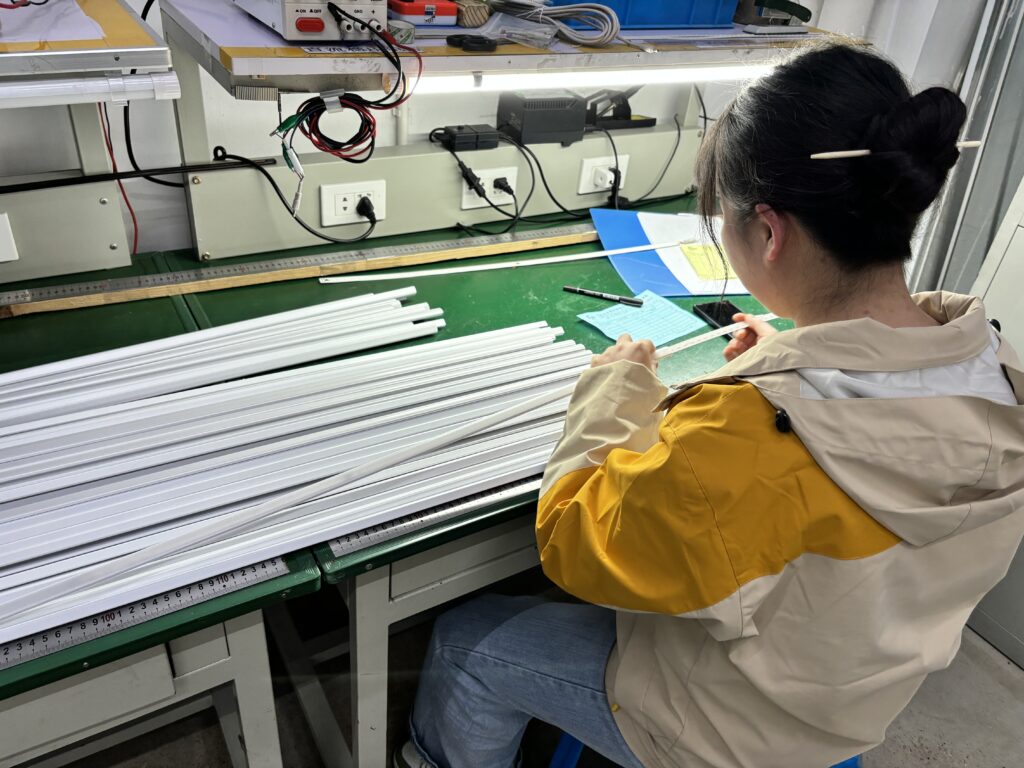 Inspectors Are Checking Whether A Batch Of Lamp Tube Casings Are Up To Standard